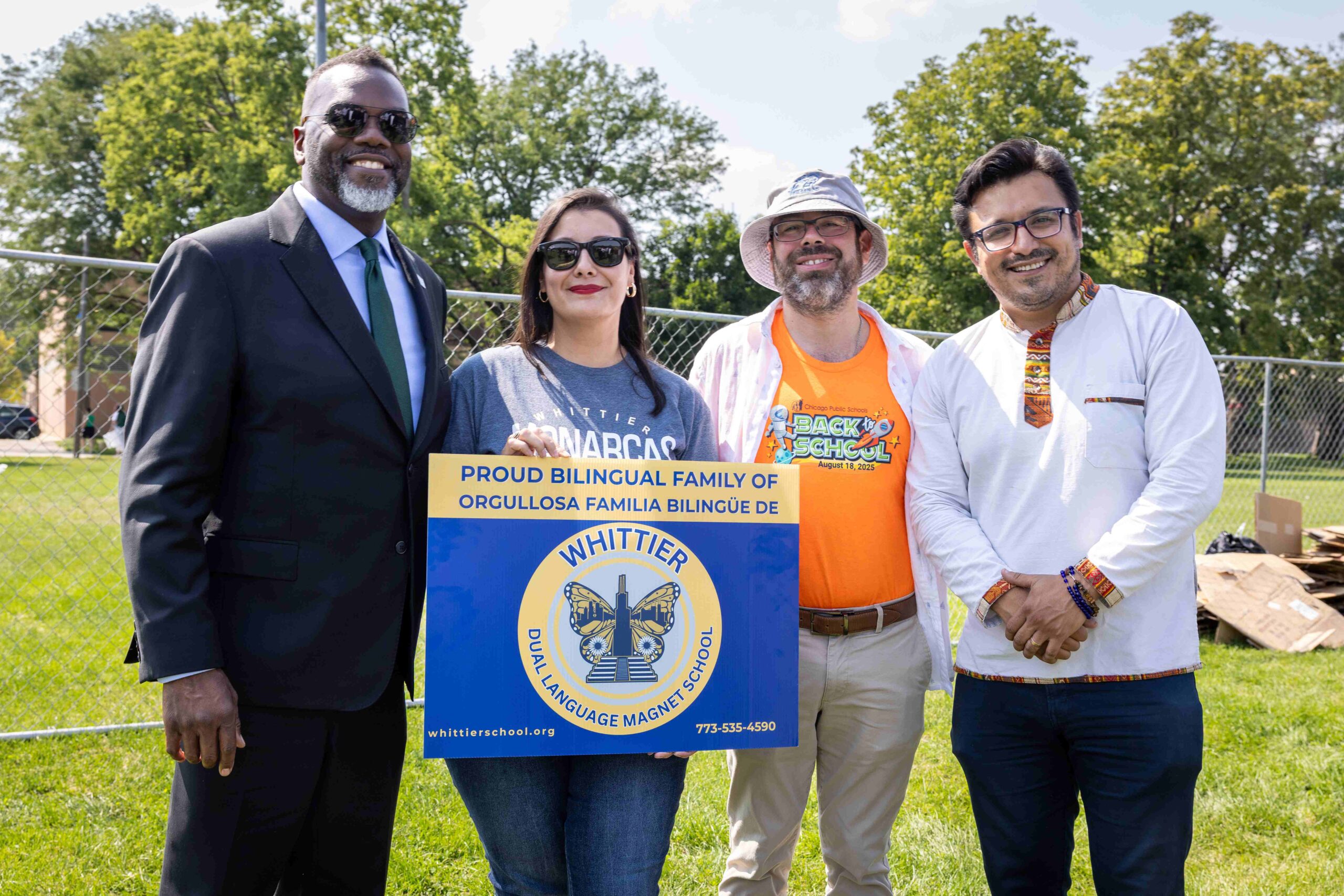 Mayor Brandon Johnson hands out Book-bags at the CPS Back to School Bash at Piotrowski Park in Little Village; August 2025.  (Peyton Reich/Office of the Mayor)